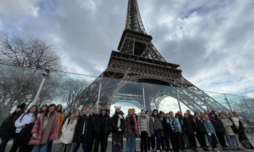 Marine Academy Primary Pupils stood with Eiffel Tower in background