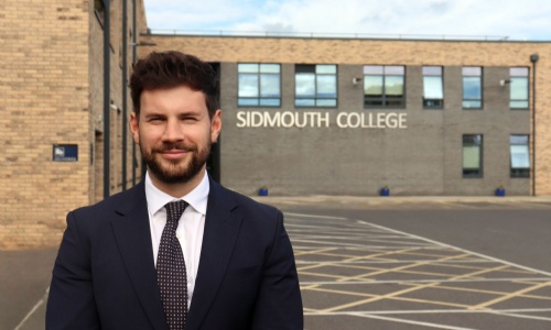 Picture of Alex Evans stood infront of Sidmouth College