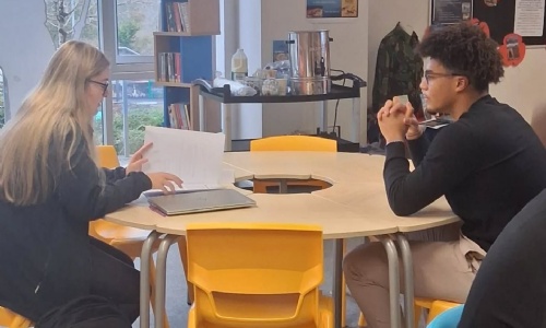 Tor Bridge Hight Students sat doing mock interviews.  