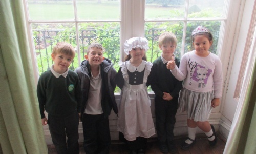 Exwick Heights School Pupils dressing up in old fashions clothes at Powderham Castle