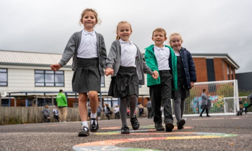CEC Children holding hands and playing the playground