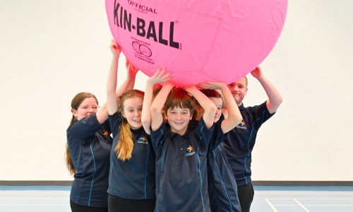 Marine Academy Plymouth Students holding up a pink ball. 