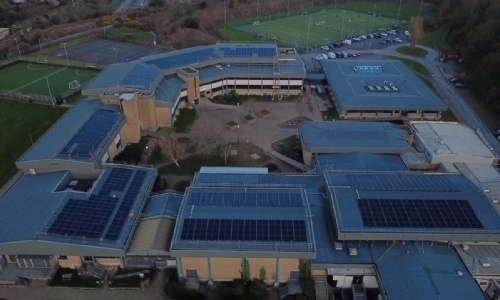 Image of Lipson building showing all the solar pannels on the roof. 