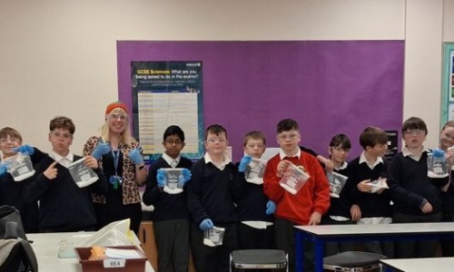 students showcasing their experiment results