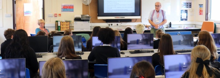 Students listening to a presentation.