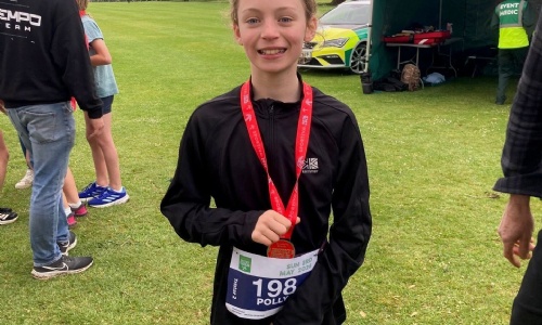 Exwick Heights pupil Polly with her medal.