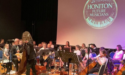 Students playing instruments on stage