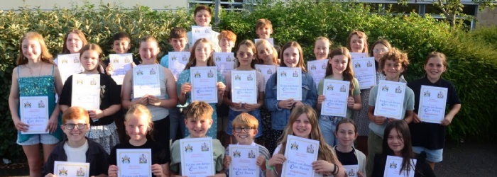 Group of students with their certificates