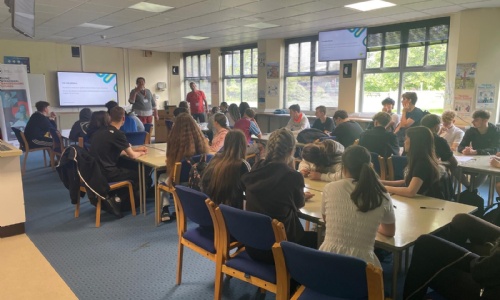 Students listening to a presentation