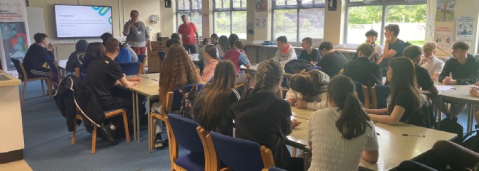 Students listening to a presentation